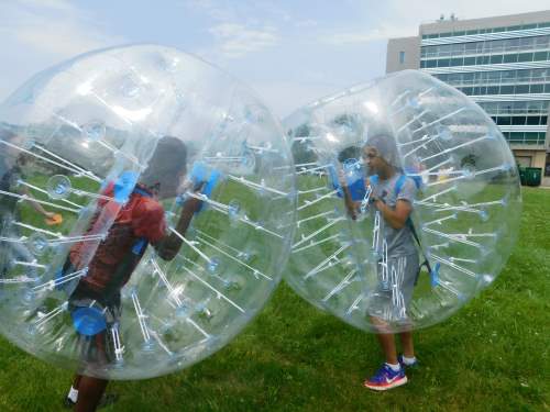 Students in bounce balls
