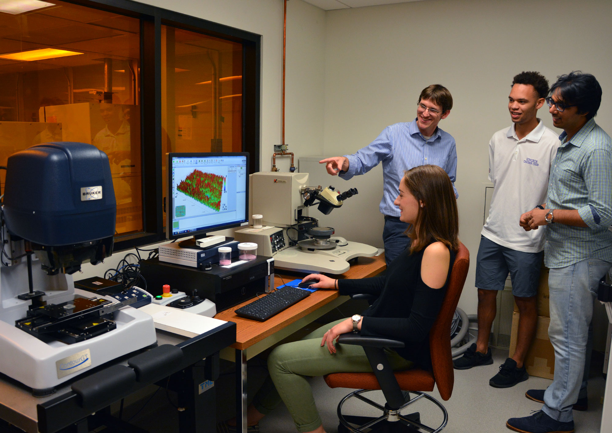 Tevis in the lab with students