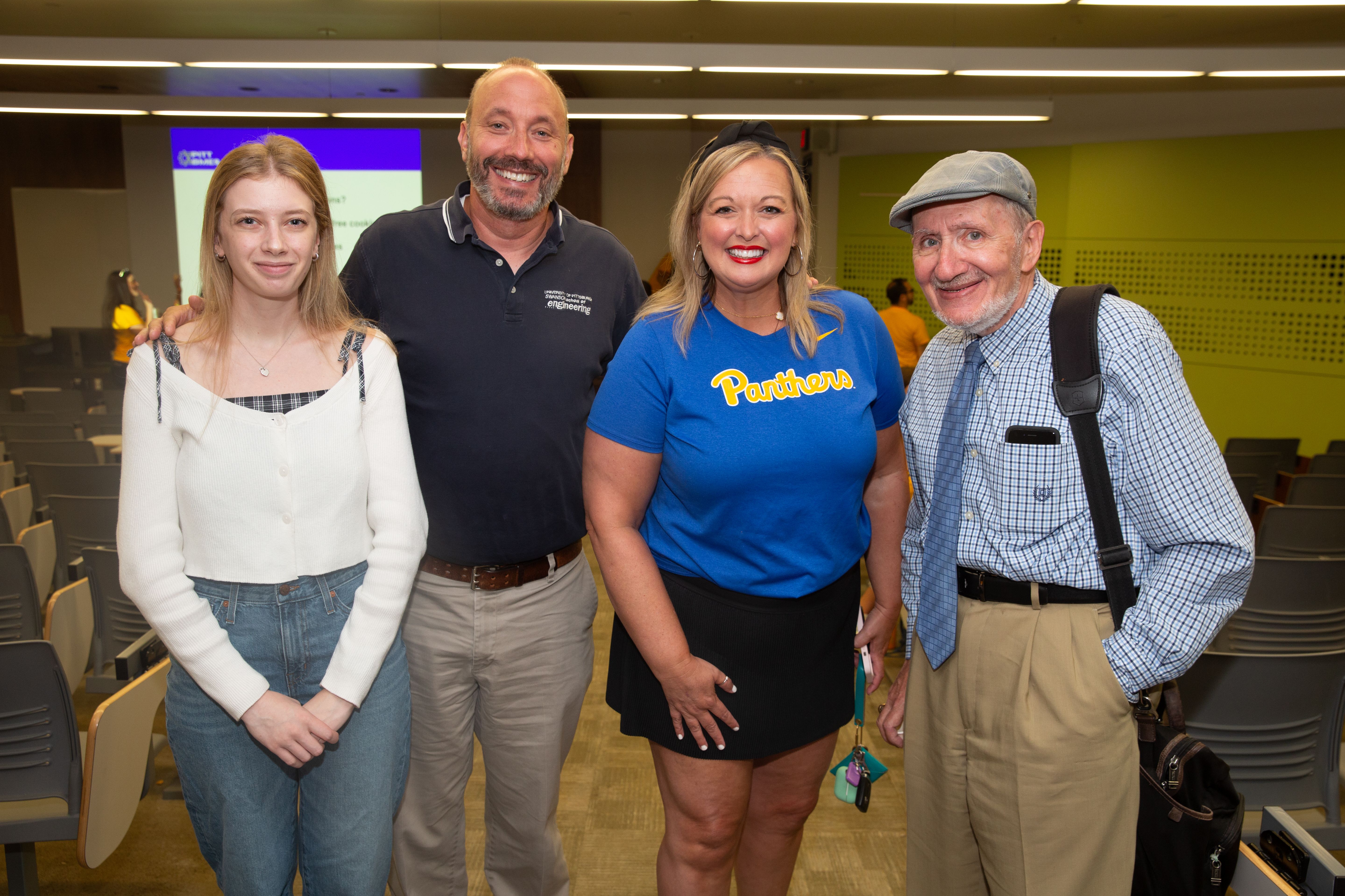 Group of people standing together smiling