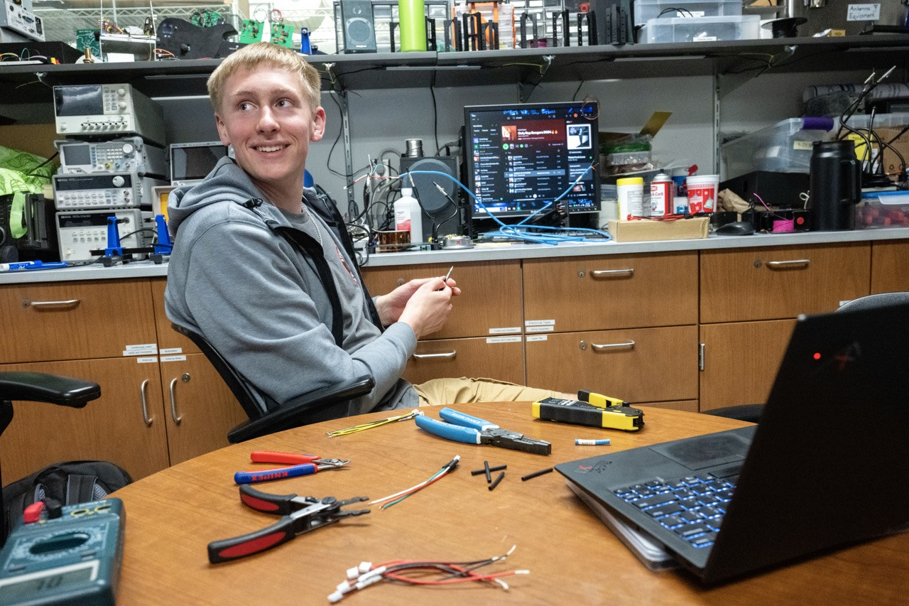 PARC office - Josh Brositz working on a wiring project (photo by Thomas Altany) PARC office