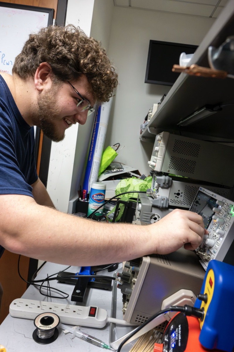 Shaffer - Sebastian Shaffer adjusting dials on radio equipment (photo by Thomas Altany) Shaffer