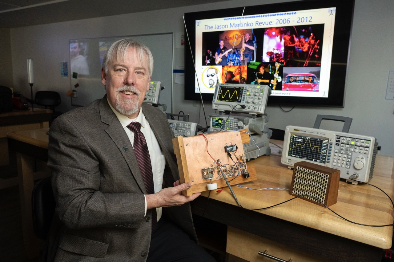 Jacobs - Steven Jacobs holding a radio his father built using the dead bug method. Jacobs