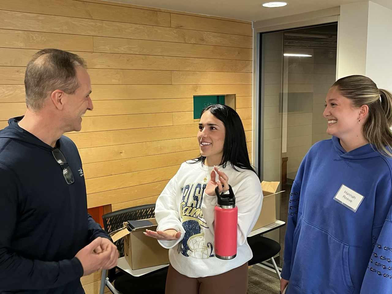 SudarReeve - Andy Sudar talking with Katie Kuselias and Hannah Reeve during a Business Essentials workshop. SudarReeve
