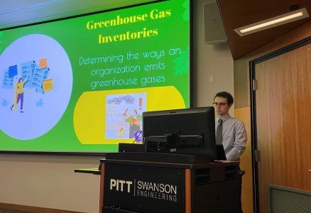 A student giving a presentation on greenhouse gas