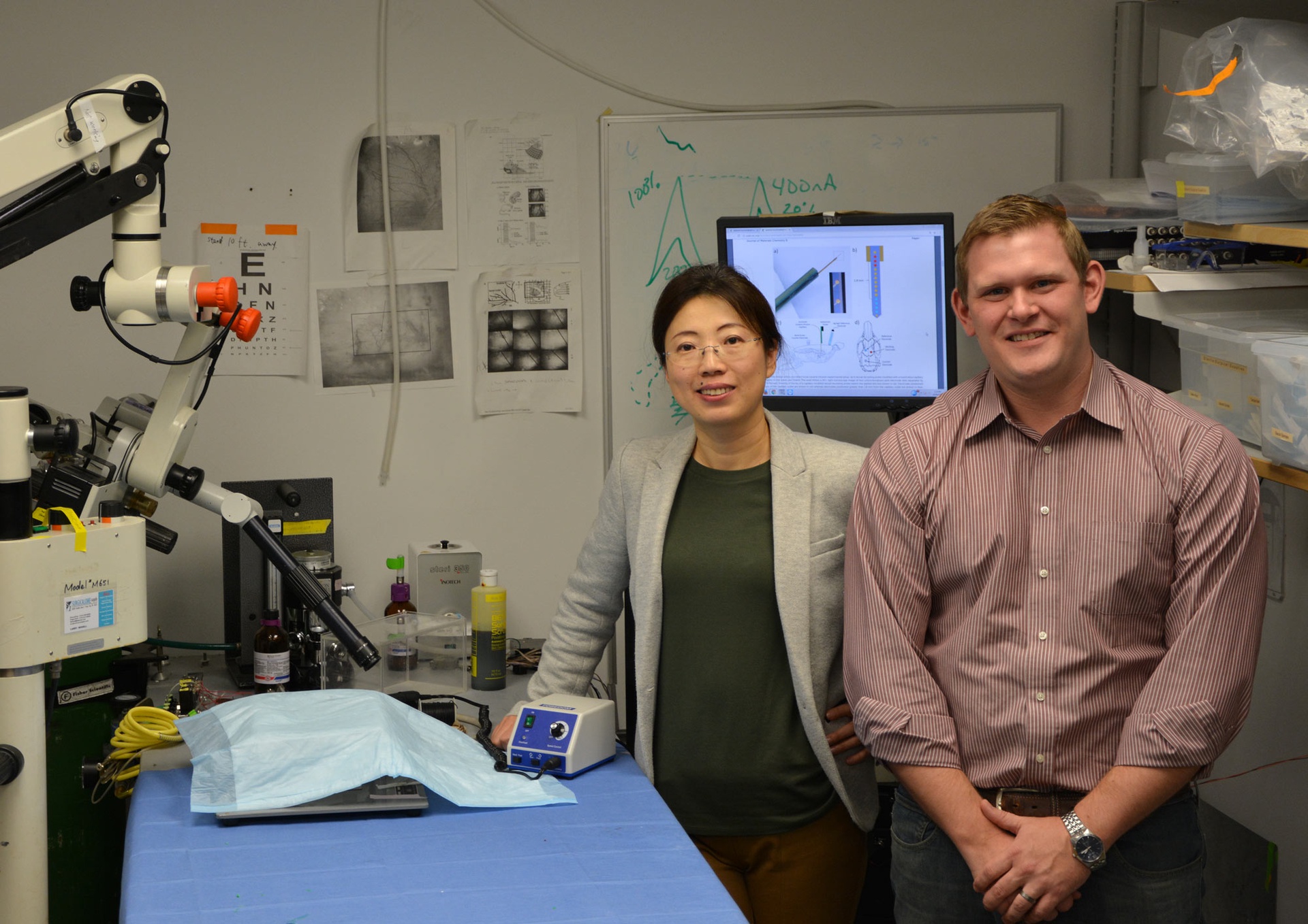   I. Mitch Taylor, postdoctoral researcher, standing by Dr. Cui  