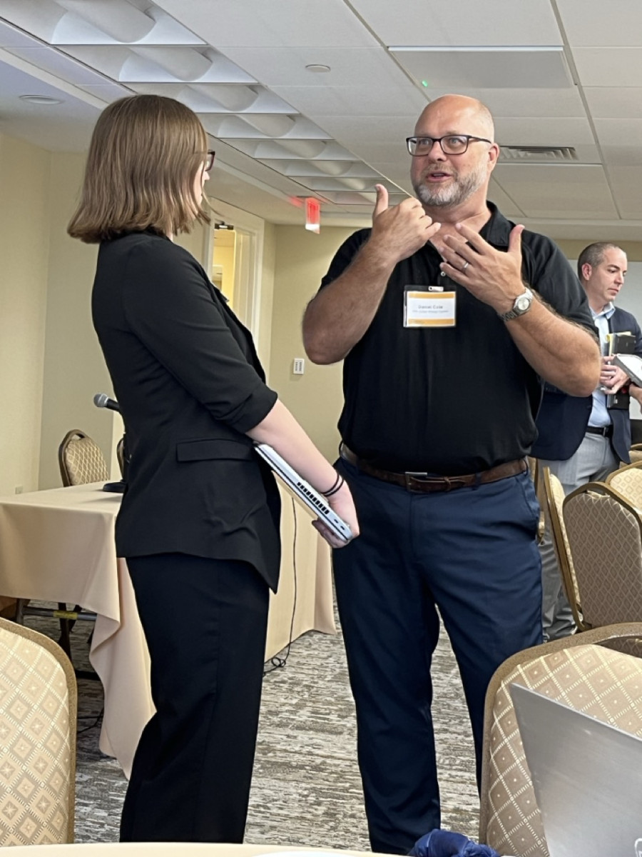 Workshop Connections - Sarah Scheffler speaking with Daniel Cole between sessions Workshop Connections