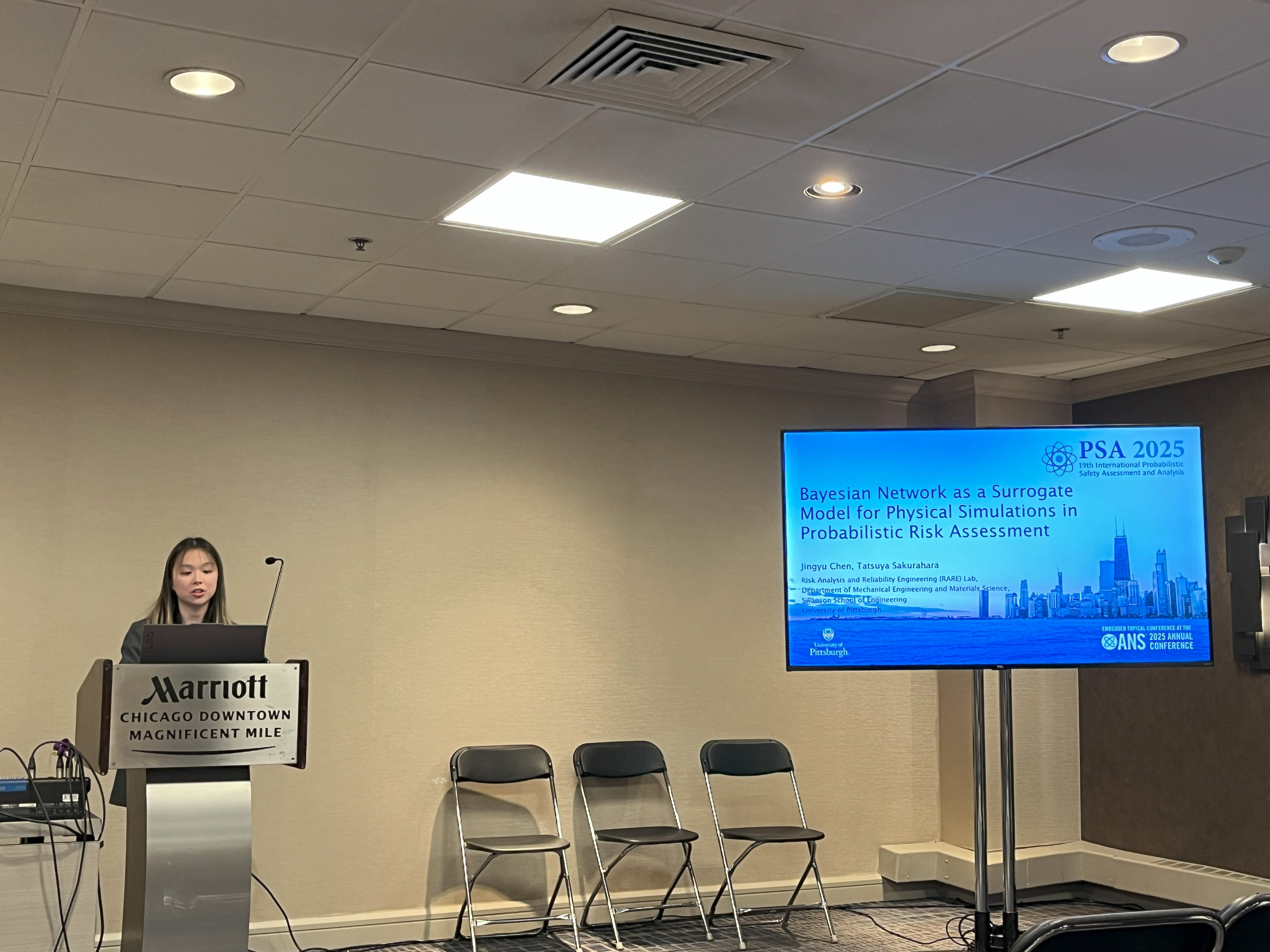 Jean Chen presenting at conference behind podium
