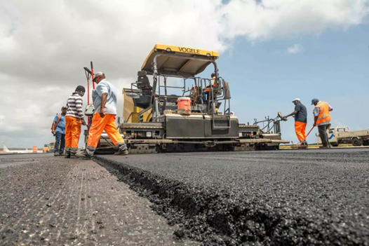 Workers laying asphalt on a road