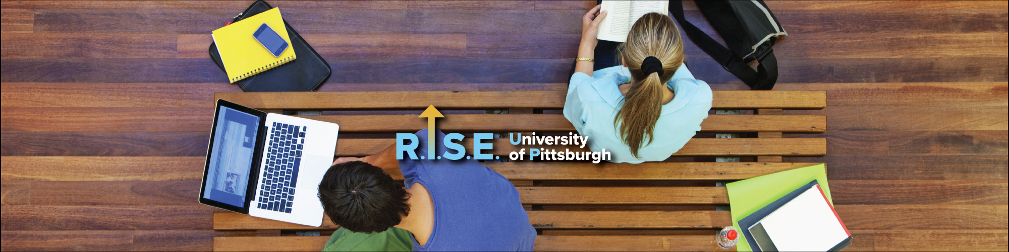 rise up banner of two students studying
