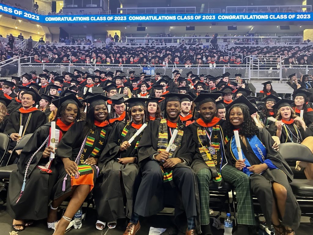 Students at graduation in cap and gowns