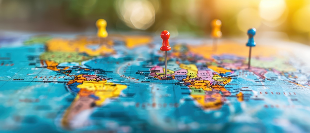 World map with push pins in it