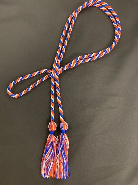 Close-up of blue, orange and white graduation cords