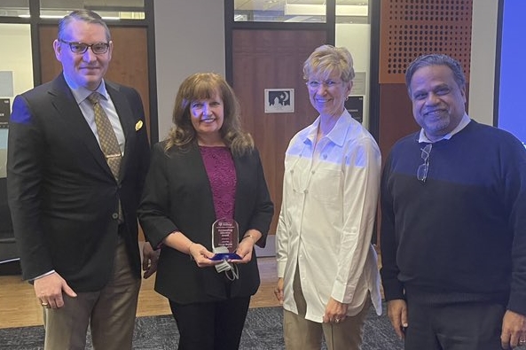 Taryn Bayles received the Outstanding Educator Award. (From left: Steven Little, Taryn Bayles, Mary Besterfield-Sacre, and Sanjeev Shroff)
