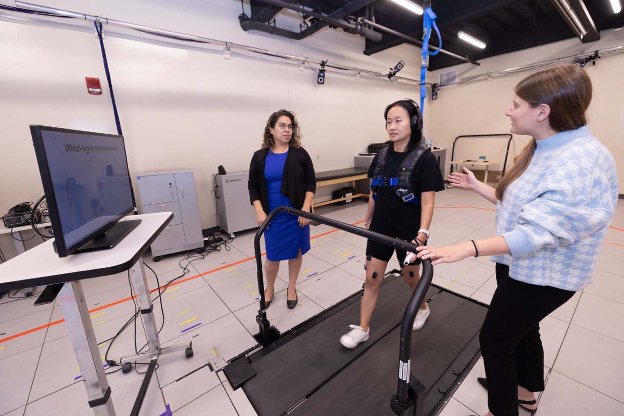 Gelsy-Torres Oviedo oversees a demo of her lab's split belt treadmill technology