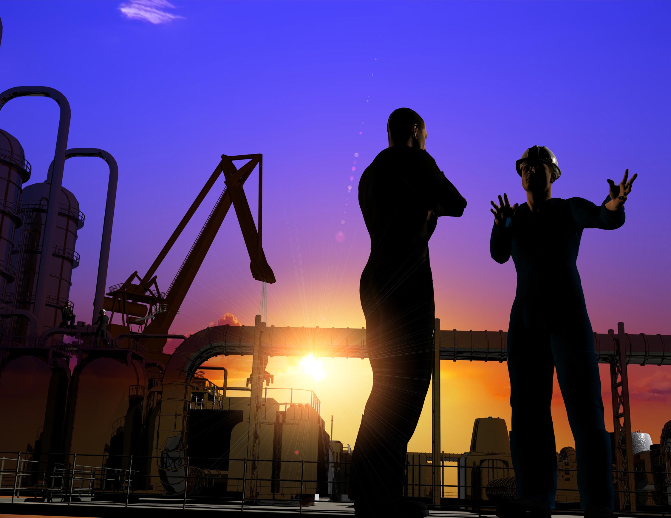 Civil engineers on a job sight and backlit by the sunset