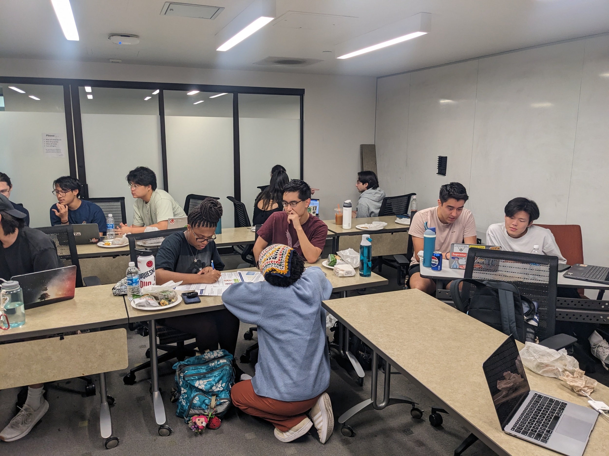 Students sitting at desk working with each other