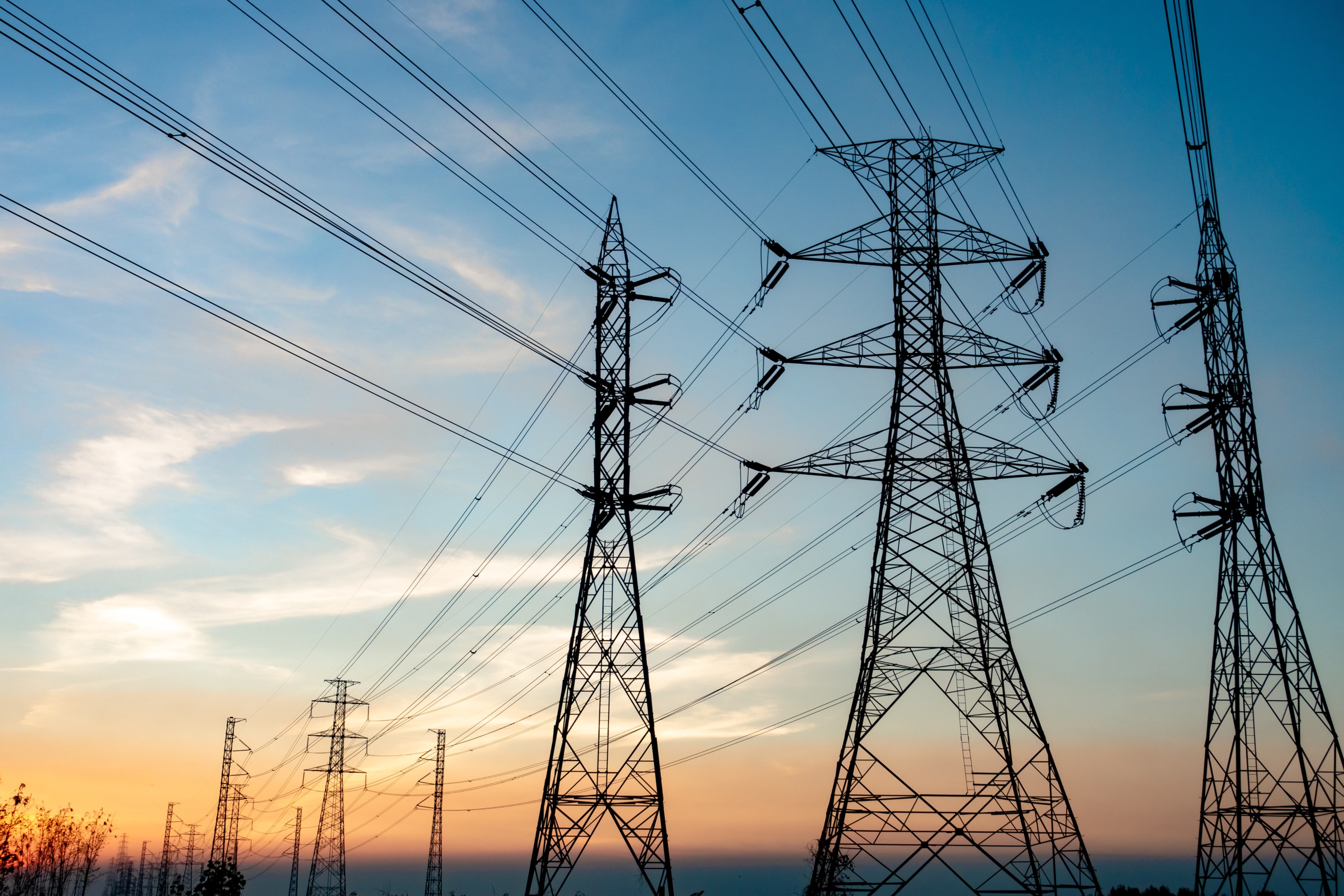 an image of power lines on high voltage towers