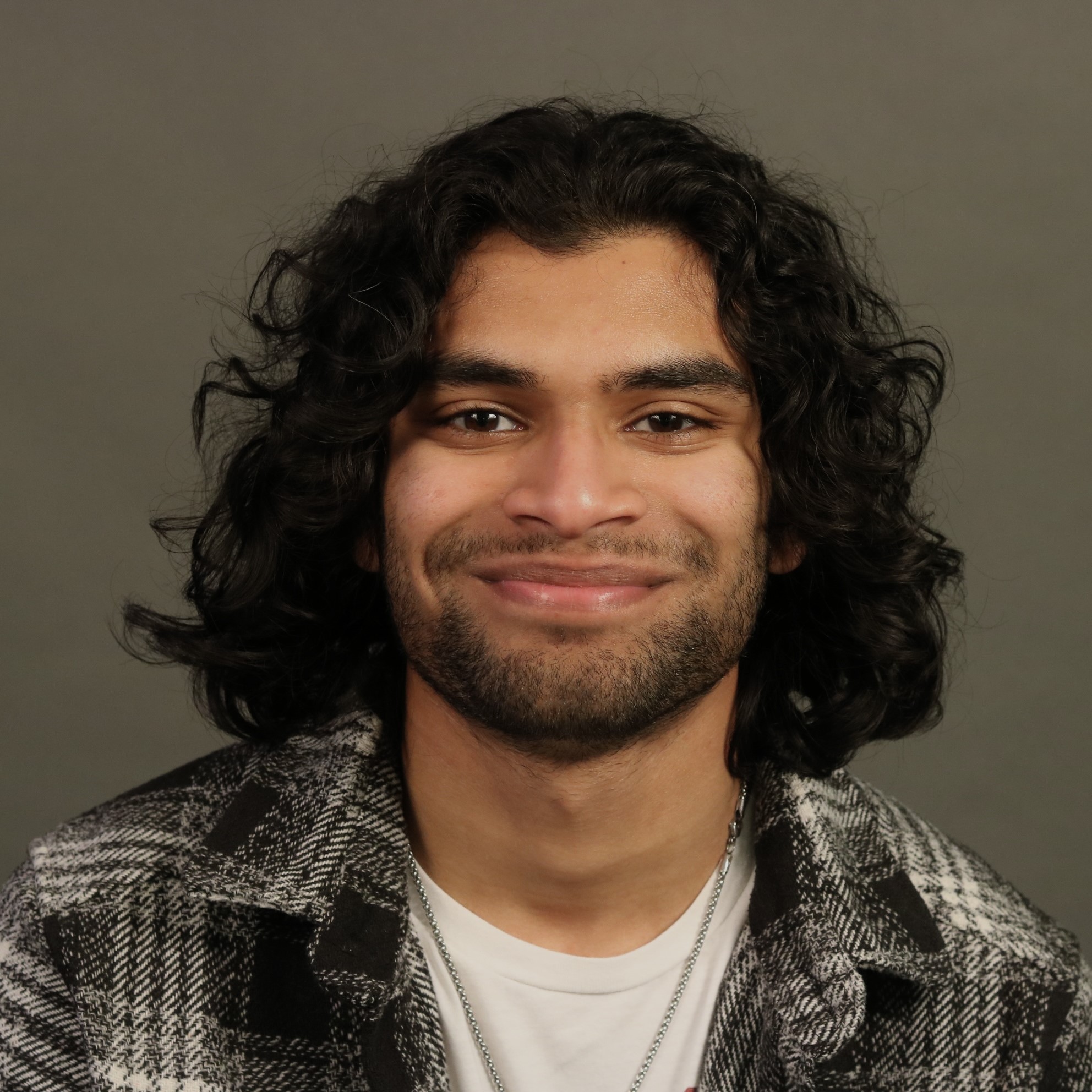 headshot of Reuel John