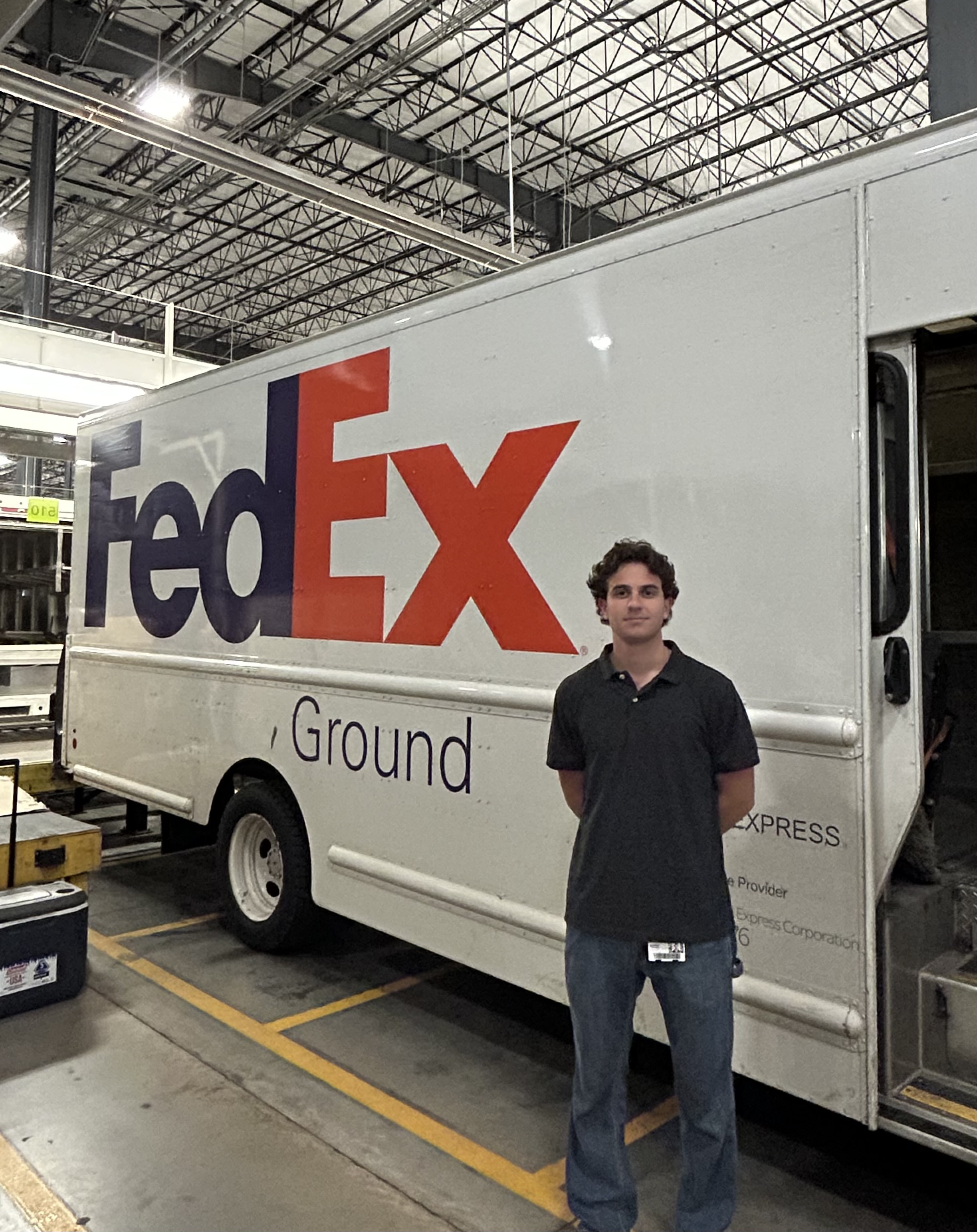 Andreas Forand by a Fedex truck