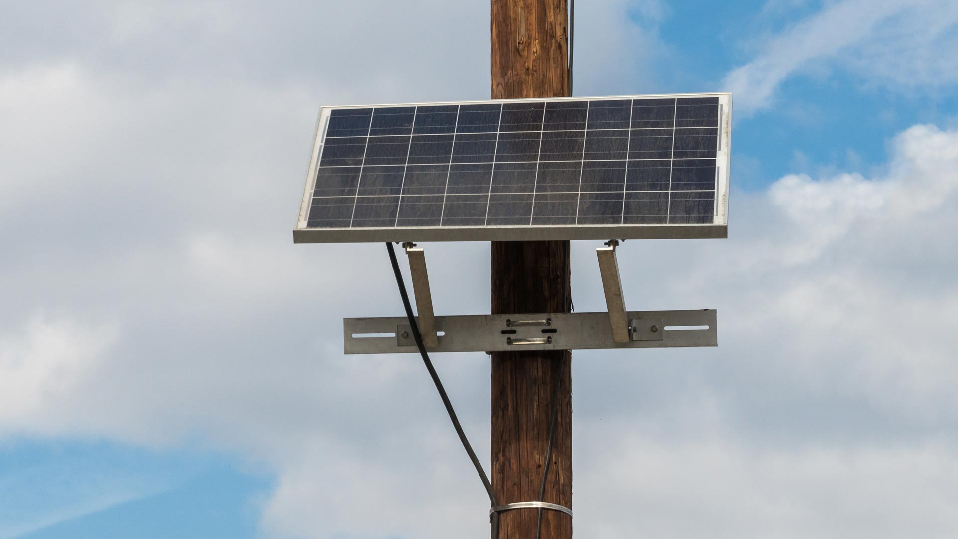 A solar panel on a telephone pole