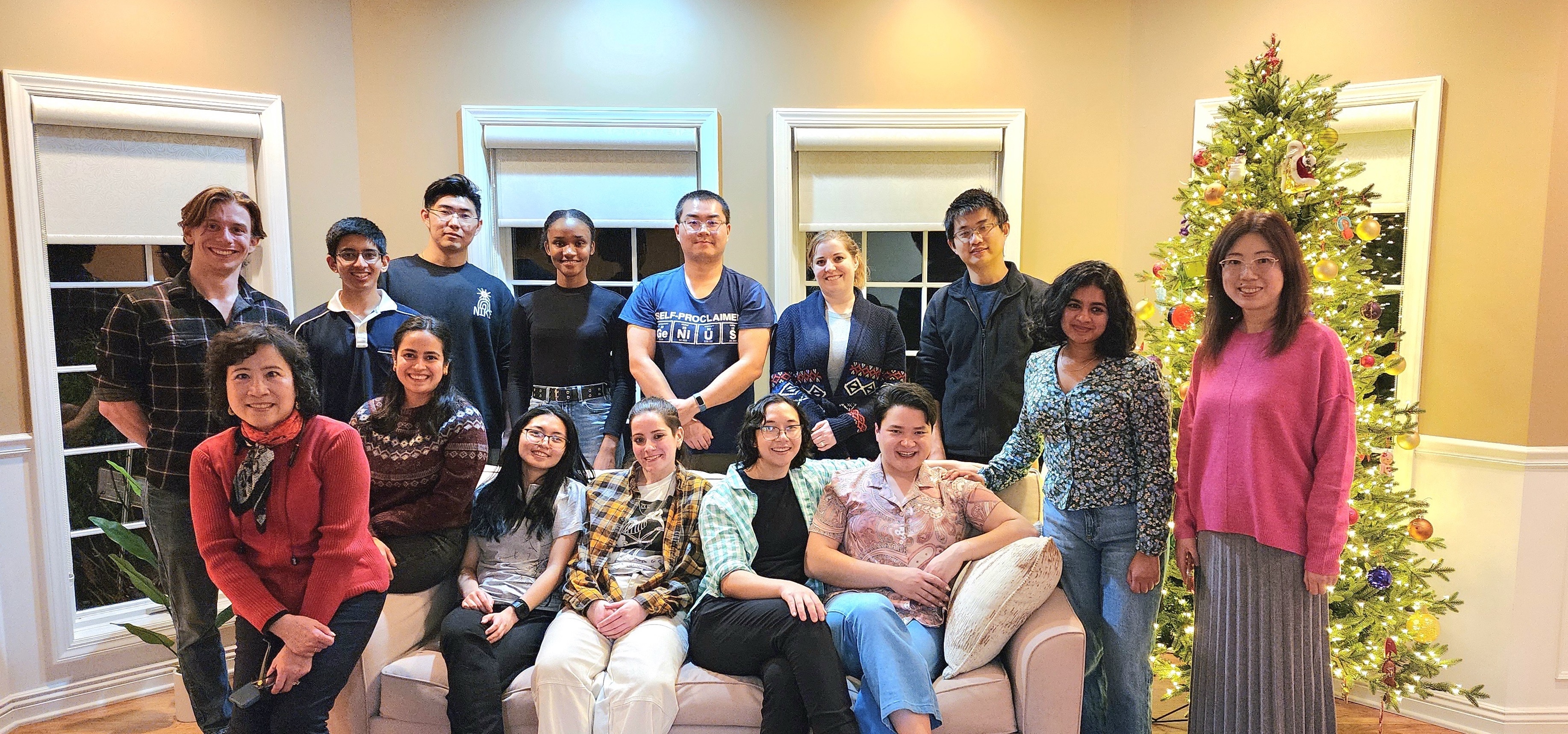 Group photo of the NTE Lab student members with Dr. Cui at a holiday party